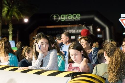 Group of Girls at Grace Church Event in front of Custom Inflatable Arch