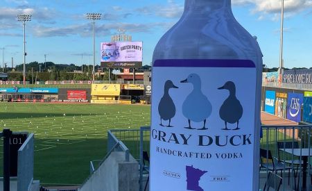 custom inflatable gray duck vodka bottle at baseball game